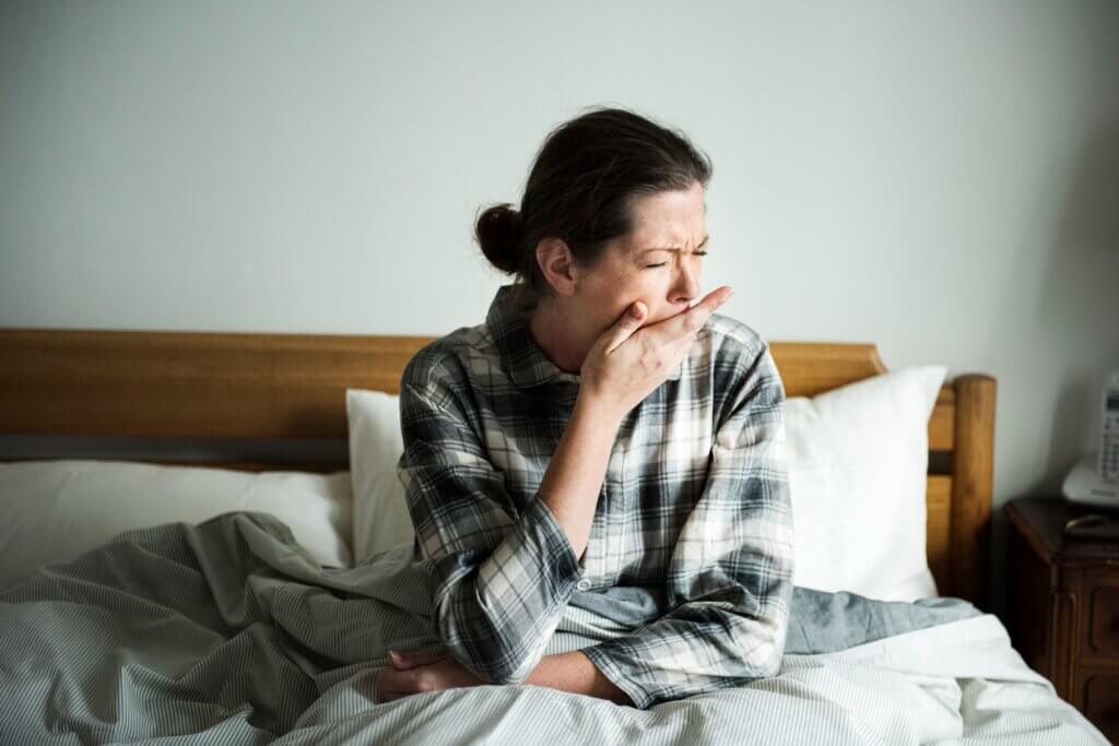 A sleepy woman waking up
